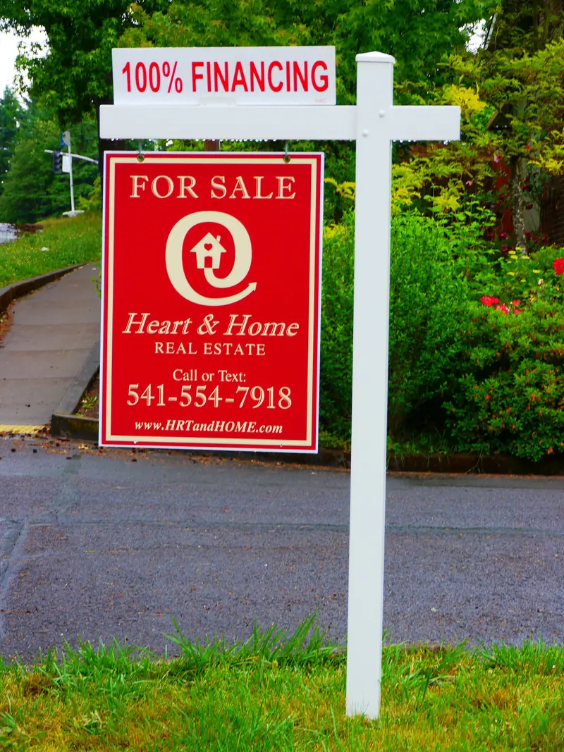 For-sale sign in front of a house